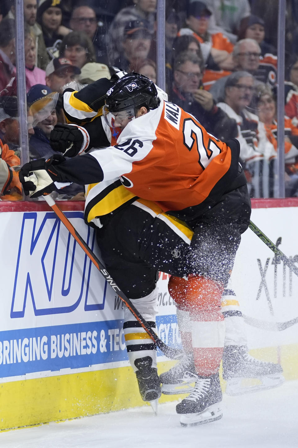 Philadelphia Flyers' Sean Walker, right, collides with Pittsburgh Penguins' Sidney Crosby during the first period of an NHL hockey game, Monday, Jan. 8, 2024, in Philadelphia. (AP Photo/Matt Slocum)