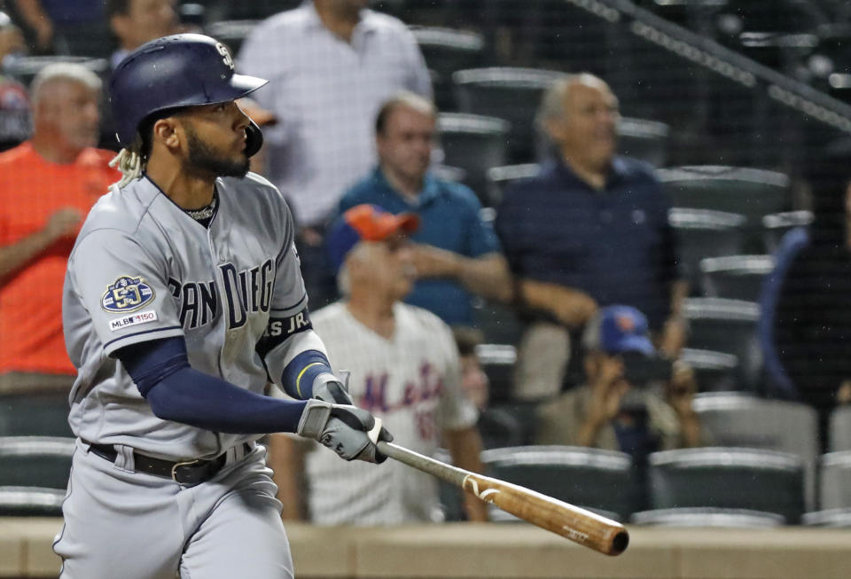 San Diego Padres' Fernando Tatis Jr. watches his RBI double to deep left center field during the ninth inning of a baseball game against the New York Mets, Tuesday, July 23, 2019, in New York. (AP Photo/Kathy Willens)