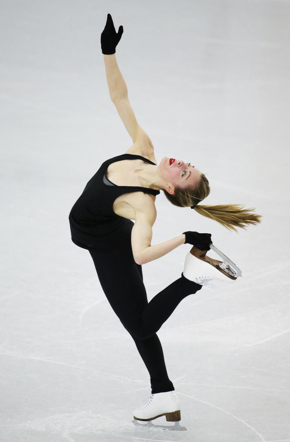 Ashley Wagner of the United States skates during a practice session at the figure stating practice rink at the 2014 Winter Olympics, Tuesday, Feb. 18, 2014, in Sochi, Russia. (AP Photo/Bernat Armangue)