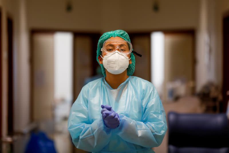 FILE PHOTO: A health care worker wears personal protective equipment in Santa Maria Hospital Intermediate care unit, during the coronavirus disease (COVID-19) pandemic in Lisbon