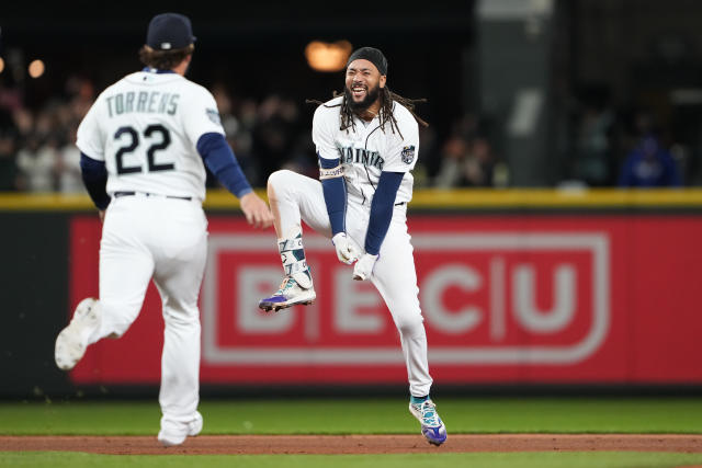 CLEVELAND, OH - APRIL 09: Seattle Mariners shortstop J.P. Crawford (3)  throws to first base for an out during the tenth inning of the Major League  Baseball game between the Seattle Mariners