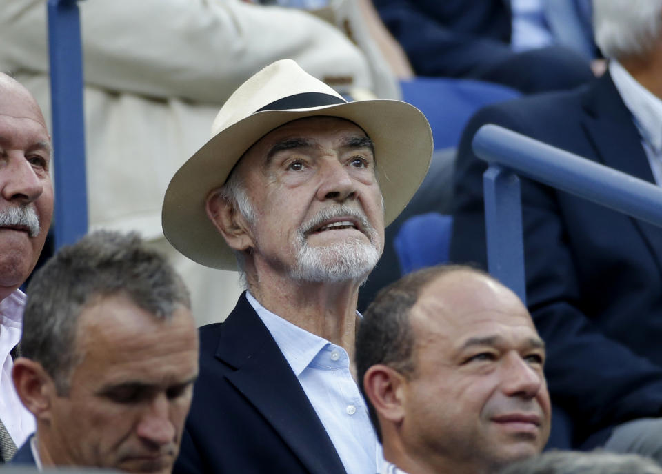 Actor Sean Connery sits in the crowd watching Novak Djokovic of Serbia play Marin Cilic of Croatia during their men's singles semi-final match at the U.S. Open Championships tennis tournament in New York, September 11, 2015. REUTERS/Mike Segar