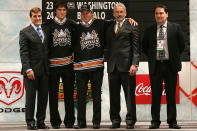 <p>Alexander Ovechkin (2nd from L) of the Washington Capitals poses with 4th overall pick Nicklas Backstrom (C) of the Capitals and team personnel on stage during the 2006 NHL Draft held at General Motors Place on June 24, 2006 in Vancouver, Canada. (Photo by Bruce Bennett/Getty Images) </p>