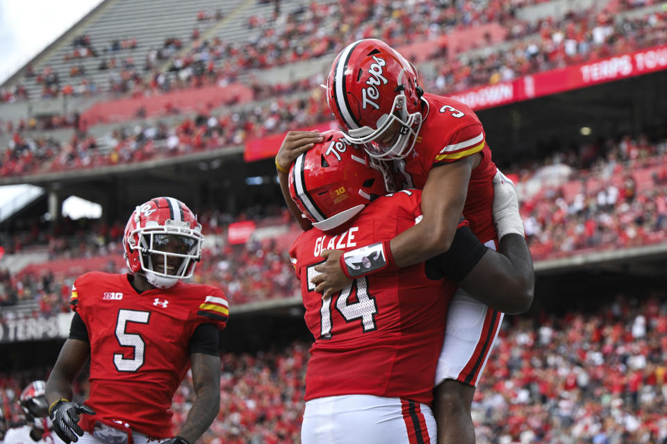 Maryland quarterback Taulia Tagovailoa (3) celebrates his touchdown with offensive lineman Delmar Glaze (74) during the first half of an NCAA college football game against Indiana, Saturday, Sept. 30, 2023, in College Park, Md. (AP Photo/Terrance Williams)