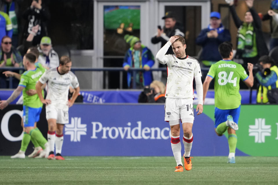 FC Dallas midfielder Asier Illarramendi (14) reacts after a goal by Seattle Sounders forward Jordan Morris during the second half of an MLS playoff soccer match Monday, Oct. 30, 2023, in Seattle. (AP Photo/Lindsey Wasson)