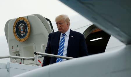 FILE PHOTO: U.S. President Donald Trump steps from Air Force One as he arrives in Morristown, New Jersey, U.S., after visiting Camp David in Maryland, U.S. on August 18, 2017. REUTERS/Kevin Lamarque/File Photo