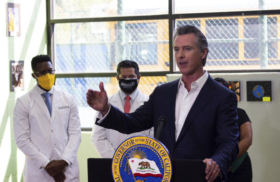 California Gov. Gavin Newsom, at the Wilmington Boys & Girls Club Thursday, Oct. 21, 2021, in Wilmington, Calif. California's oil and gas regulator on Thursday proposed that the state ban new oil drilling within 3,200 feet of schools, homes and hospitals to protect public health in what would be the nation's largest buffer zone between oil wells and communities (Hunter Lee/The Orange County Register via AP)