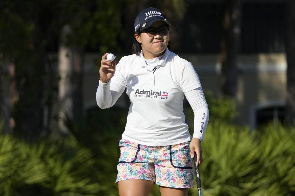 Nasa Hataoka, of Japan, acknowledges the crowd after a birdie putt on the 10th green during the third round of the LPGA CME Group Tour Championship golf tournament, Saturday, Nov. 18, 2023, in Naples, Fla. (AP Photo/Lynne Sladky)