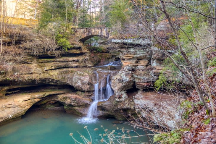 Cedar Falls flows through a canyon in the wilderness of Hocking Hills State Park in Logan, Ohio