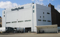 FILE - This April 8, 2020, file photo shows the Smithfield pork processing plant in Sioux Falls, S.D. Hundreds of meatpacking workers have been vaccinated against the coronavirus but the union that represents them says several hundred thousand more have not, despite the risks they continue to face at work. (AP Photo/Stephen Groves, File)