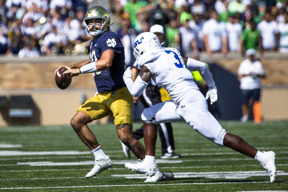 Notre Dame's Sam Hartman (10) looks to throw as Tennessee State's Monroe Beard III (3) defends him during the first half of an NCAA college football game on Saturday, Sept. 2, 2023 in South Bend, Ind. (AP Photo/Michael Caterina)