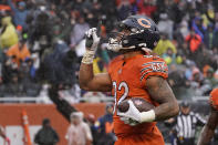 Chicago Bears running back David Montgomery celebrates his touchdown during the first half of an NFL football game against the Arizona Cardinals Sunday, Dec. 5, 2021, in Chicago. (AP Photo/David Banks)