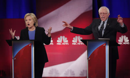 Hillary Clinton and Bernie Sanders speak simultaneously at the NBC News - YouTube Democratic presidential candidates debate in Charleston, South Carolina, January 17, 2016. REUTERS/Randall Hill