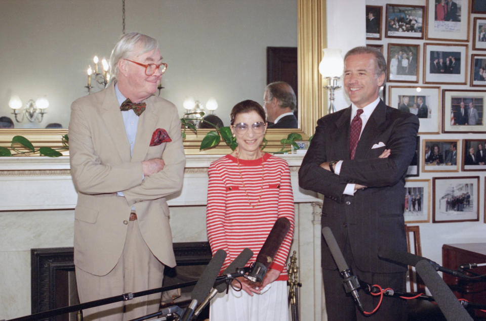 FILE - In this June 15, 1993, file photo, Judge Ruth Bader Ginsburg poses with Sen. Daniel Patrick Moynihan, D-N.Y., left, and Sen. Joseph Biden, D-Del., chairman of the Senate Judiciary Committee on Capitol Hill in Washington. The Supreme Court says Ginsburg has died of metastatic pancreatic cancer at age 87. (AP Photo/Marcy Nighswander, File)