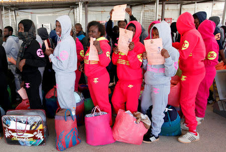 FILE PHOTO: Illegal African migrants arrive at Mitiga International Airport before their voluntary return to their countries, east of Tripoli, Libya, March 23, 2017. REUTERS/Ismail Zitouny/File Photo