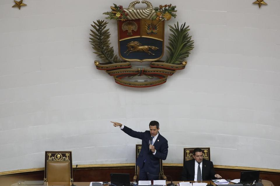 Venezuelan Opposition leader and self-proclaimed interim president of Venezuela Juan Guaido speaks during a weekly session at the National Assembly in Caracas, Venezuela, Tuesday, Sept 17, 2019. A group of minority opposition parties is entering negotiations with President Nicolas Maduro's government without the consent of the U.S. backed opposition leader Juan Guaido. (AP Photo/Ariana Cubillos)