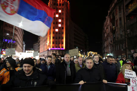 Demonstrators walk along a street during an anti-government protest in central Belgrade, Serbia, December 8, 2018. Thousands rallied peacefully in downtown Belgrade on Saturday to protest the beating of an opposition politician, policies of President Aleksandar Vucic and his ruling Serbian Progressive party. REUTERS/Marko Djurica