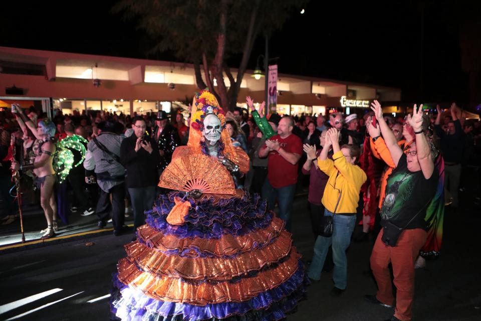 People in costume attend Palm Springs Halloween on Arenas Road in Palm Springs, Calif., on Thursday, October 31, 2019. 