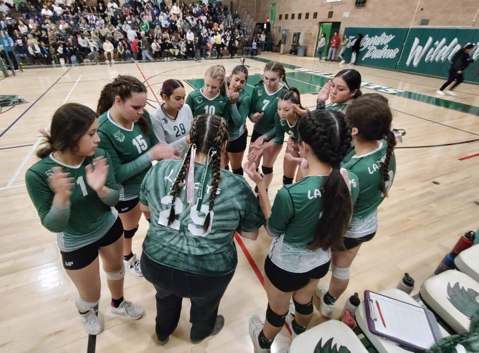 Twentynine Palms volleyball huddles up before their CIF-SS Division 8 championship game against United Christian Academy on Saturday.
