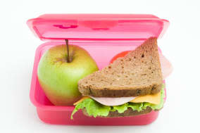 lunch box with sandwich and...