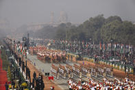 Indian para-military force soldiers march through the ceremonial Rajpath boulevard during India's Republic Day celebrations in New Delhi, India, Tuesday, Jan.26, 2021. Republic Day marks the anniversary of the adoption of the country's constitution on Jan. 26, 1950. (AP Photo/Manish Swarup)