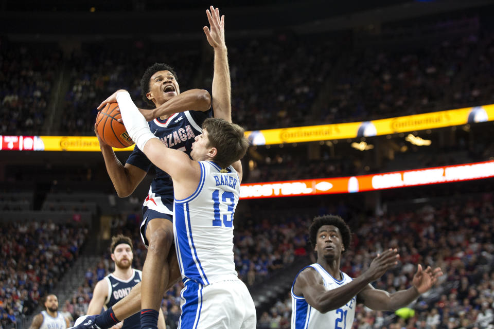 Gonzaga guard Rasir Bolton shoots against Duke forward Joey Baker (13) during the first half of an NCAA college basketball game Friday, Nov. 26, 2021, in Las Vegas. (AP Photo/Ellen Schmidt)