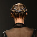 <b>Bora Aksu </b><br><br>Models' hair was slicked back with wet-look gel and plaited at the back of their heads with blue strands.<br><br>Image © Getty