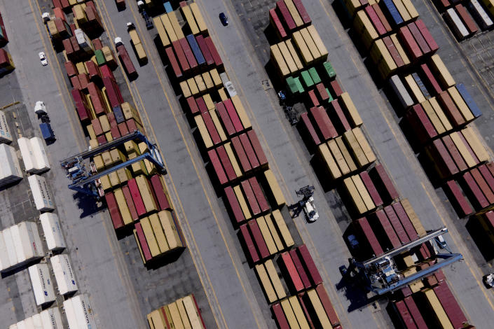 Shipping containers are stacked together at the Port of Baltimore, Friday, Aug. 12, 2022, in Baltimore. The Associated Press found more than 3,600 shipments of wood, metals, rubber and other goods have arrived at U.S. ports from Russia since it began launching missiles and airstrikes into its neighbor in February. (AP Photo/Julio Cortez)