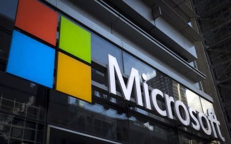 A Microsoft logo is seen on an office building in New York City, July 28, 2015. The global launch of the Microsoft Windows 10 operating system will take place on July 29. REUTERS/Mike Segar