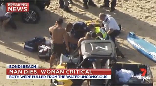 A woman was also pulled from the surf. Picture: 7 News