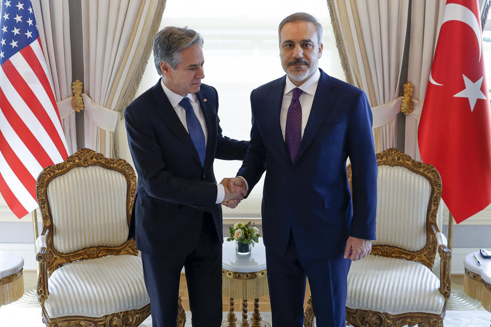 U.S. Secretary of State Antony Blinken, left, shakes hands with Turkish Foreign Minister Hakan Fidan at Vahdettin, a private residence of the Presidency, in Istanbul, Turkey, Saturday, Jan. 6, 2024. (Evelyn Hockstein/Pool Photo via AP)
