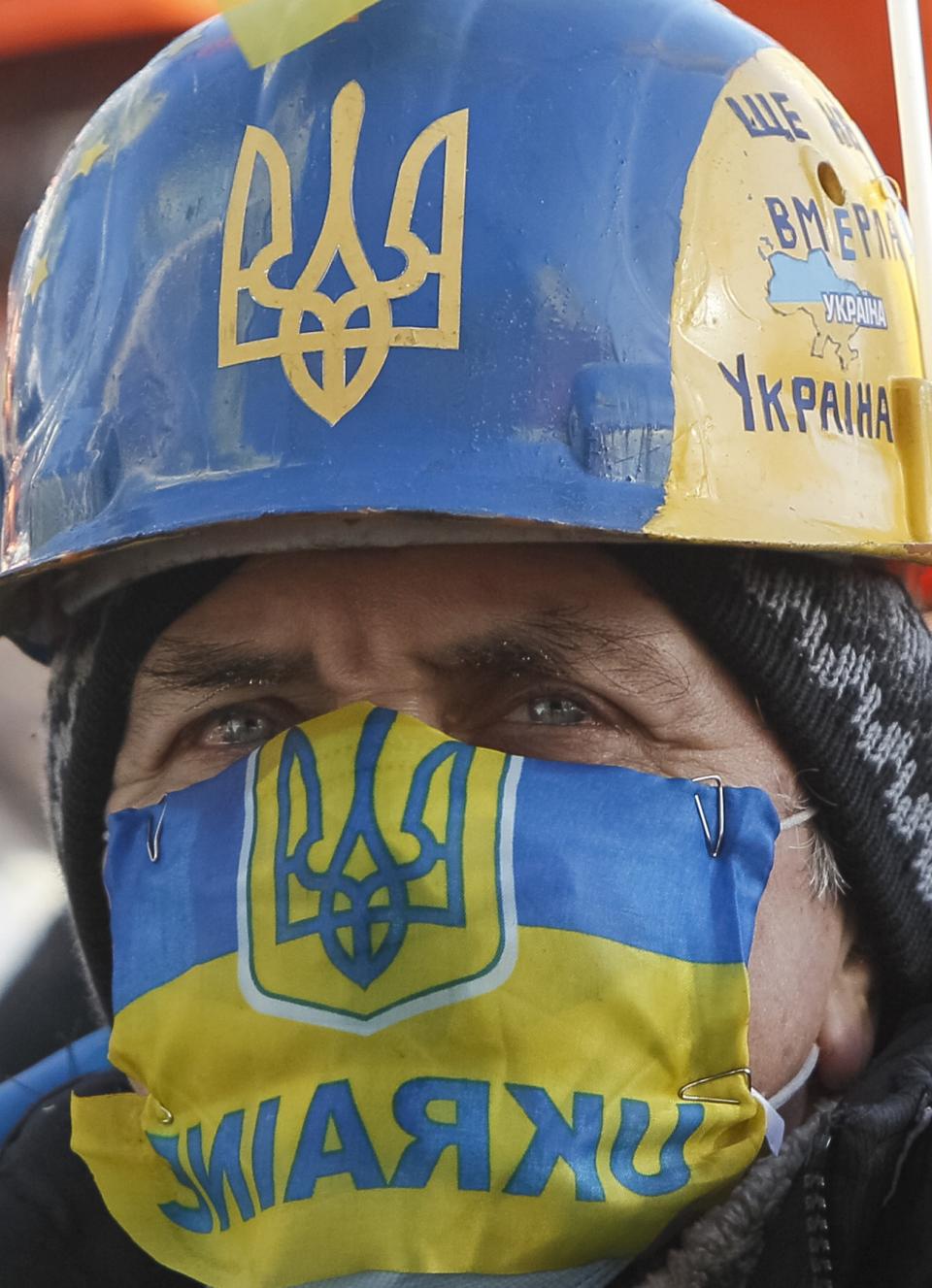 Anti-government protester attends a rally in Independence Square in central Kiev