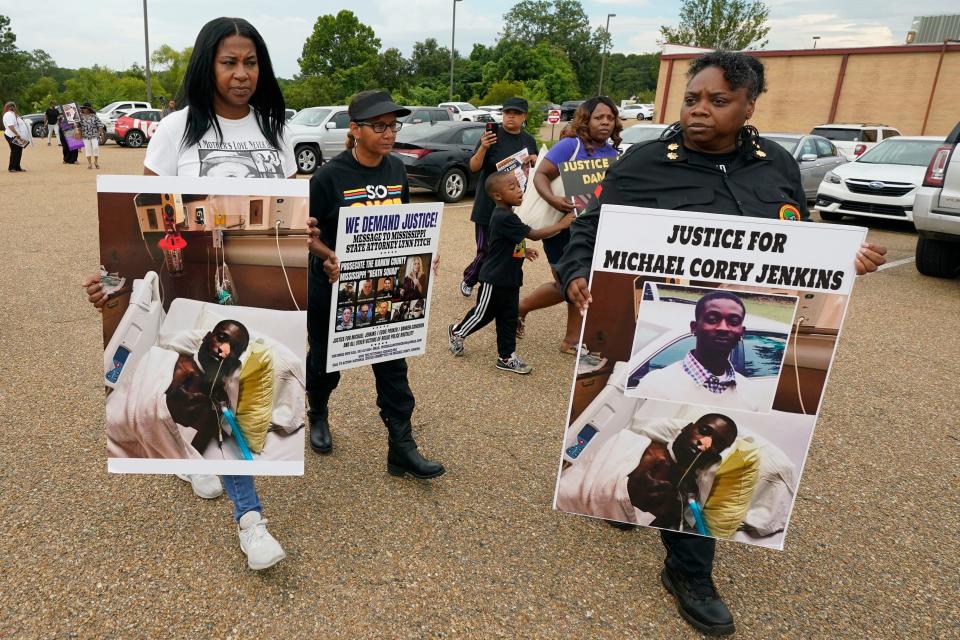 Activists march towards the Rankin County Sheriff's Office in Brandon, Miss., Wednesday, July 5, 2023, calling for the termination and prosecution of Rankin County Sheriff Bryan Bailey for running a law enforcement department that allegedly terrorizes and brutalizes minorities. Six white former law enforcement officers in Mississippi have pleaded guilty to a racist assault on Michael Corey Jenkins and his friend Eddie Terrell Parker, who are Black.