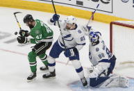 Dallas Stars right wing Alexander Radulov (47) and Tampa Bay Lightning defenseman Erik Cernak (81) work in front of Lightning goaltender Andrei Vasilevskiy (88) during the first period of Game 4 of the NHL hockey Stanley Cup Final, Friday, Sept. 25, 2020, in Edmonton, Alberta. (Jason Franson/The Canadian Press via AP)