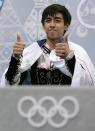 Michael Christian Martinez of the Philippines gives the thumbs up after the men's short program figure skating competition at the Iceberg Skating Palace during the 2014 Winter Olympics, Thursday, Feb. 13, 2014, in Sochi, Russia. (AP Photo/Ivan Sekretarev)