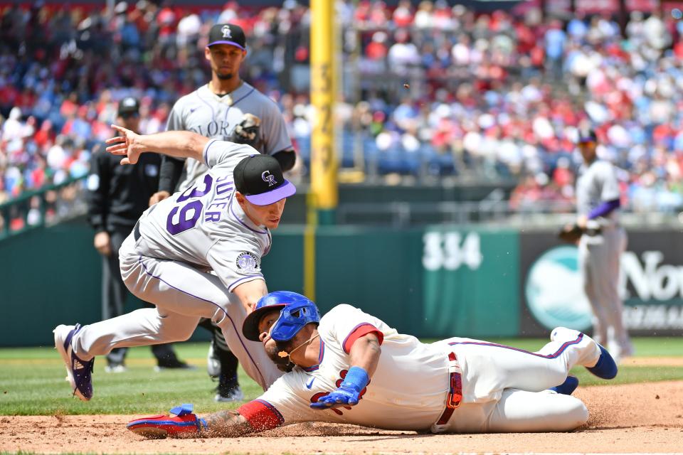 April 23: The Philadelphia Phillies' Edmundo Sosa is tagged out by Colorado Rockies pitcher Brent Suter after being picked off and caught in a rundown during the fifth inning at Citizens Bank Park. The Phillies won the game, 9-3.