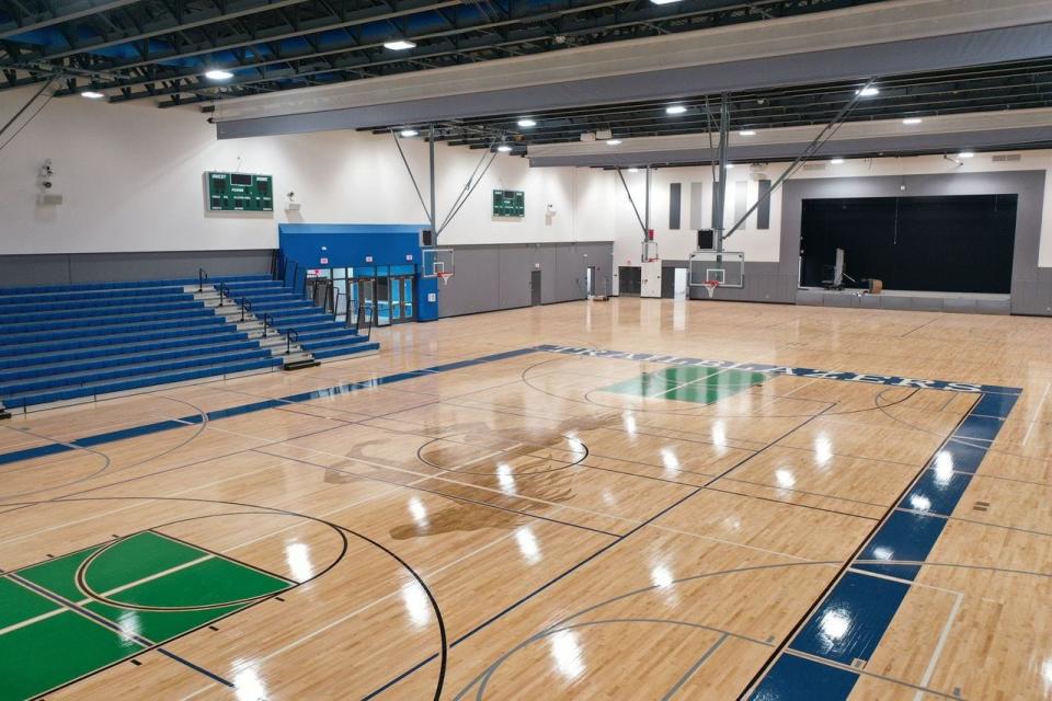 The field house features a cafeteria, fitness room and this gym that doubles as an auditorium. It has three full basketball courts and removable bleachers. When school is not in session the gym and cafeteria will be used by the community.