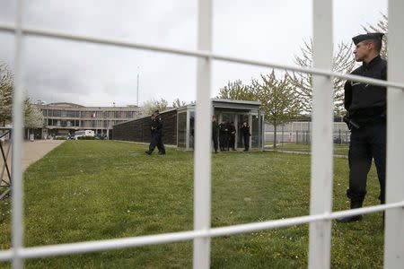 French gendarme at the entrance of the Fleury-Merogis prison near Paris after the arrival of a police convoy believed to be carrying Salah Abdeslam, believed to be the sole survivor among a group of Islamist militants who killed 130 people in Paris in November, France, April 27, 2016. REUTERS/Christian Hartmann