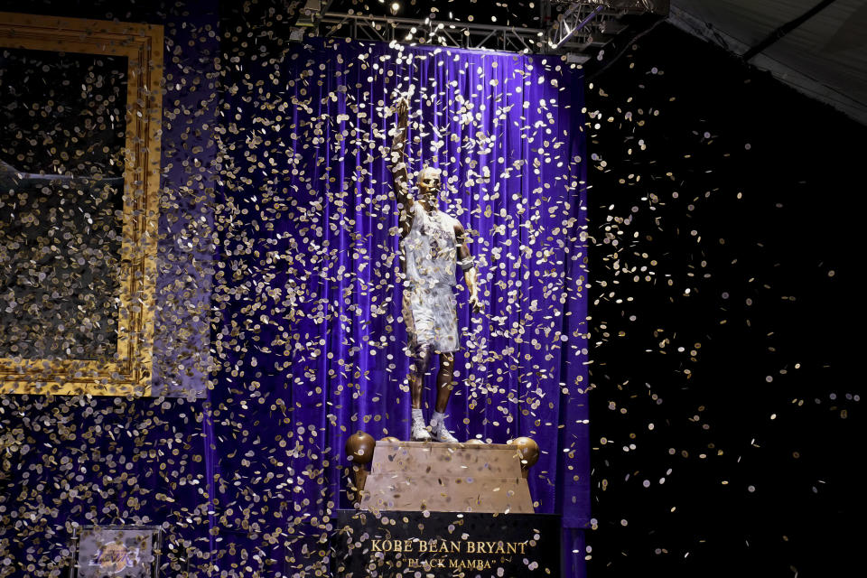 Confetti is released during unveiling of a statue in honor of former Los Angeles Lakers guard Kobe Bryant outside the NBA basketball team's arena, Thursday, Feb. 8, 2024, in Los Angeles. (AP Photo/Eric Thayer)