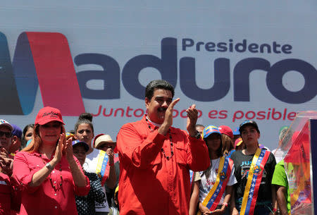 Venezuela's President Nicolas Maduro and his wife Cilia Flores take part in a campaign rally in Ciudad Guayana, Venezuela April 23, 2018. Miraflores Palace/Handout via REUTERS