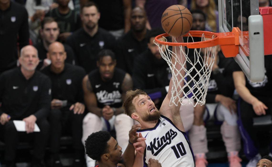 Sacramento Kings center Domantas Sabonis (10) dunks against the New Orleans Pelicans during an NBA play-in game at Smoothie King Center in New Orleans on Friday, April 19, 2024.