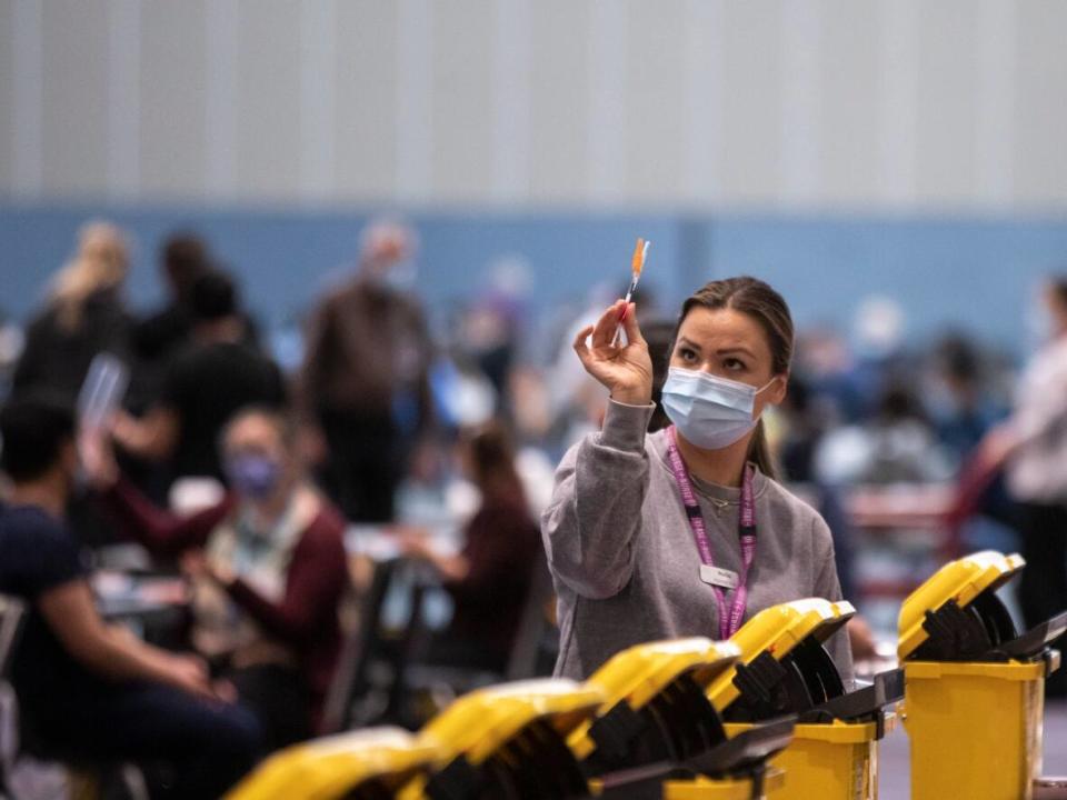 A COVID-19 vaccination clinic at the Vancouver Convention Centre in Vancouver, British Columbia on Thursday, Jan. 13, 2022.  (Ben Nelms/CBC - image credit)