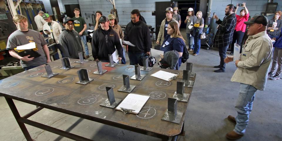 Students from area high schools pick up their project to weld during a welding competition held Friday, April 28, 2023, at Cleveland County Community College in Shelby.