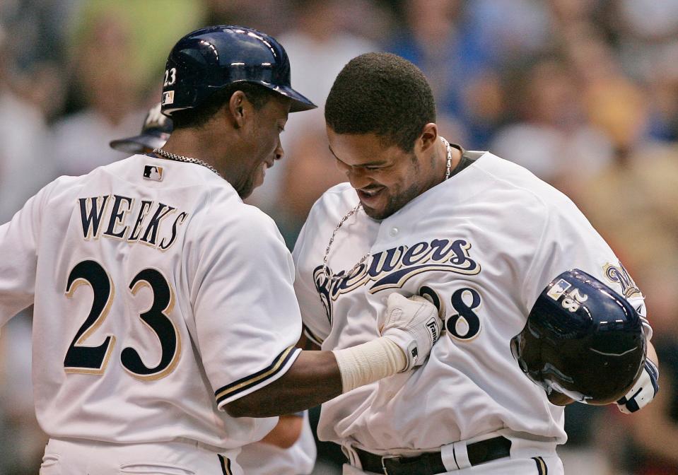 Rickie Weeks, left, congratulates Prince Fielder at home plate after Fielder hit his first major league home run during the sixth inning against the Minnesota Twins, Saturday, June 25, 2005, in Milwaukee. Weeks hit his first major league home run earlier in the game.
