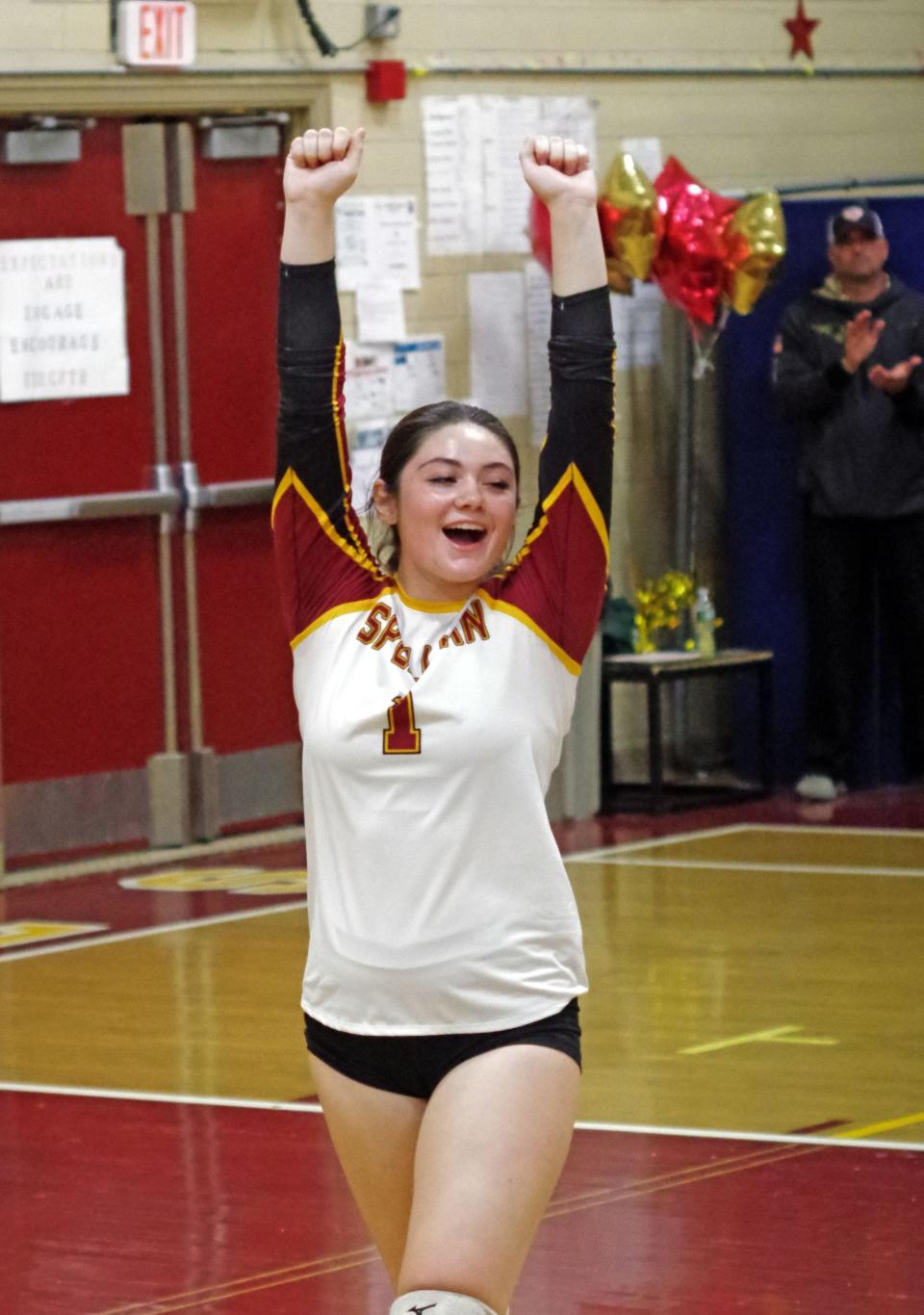 Mikayla Bush celebrates after applying some tough defense with her Cardinal Spellman teammates to slow down a surge by Bishop Fenwick in the girls volleyball game on Thursday, Oct. 27, 2022.