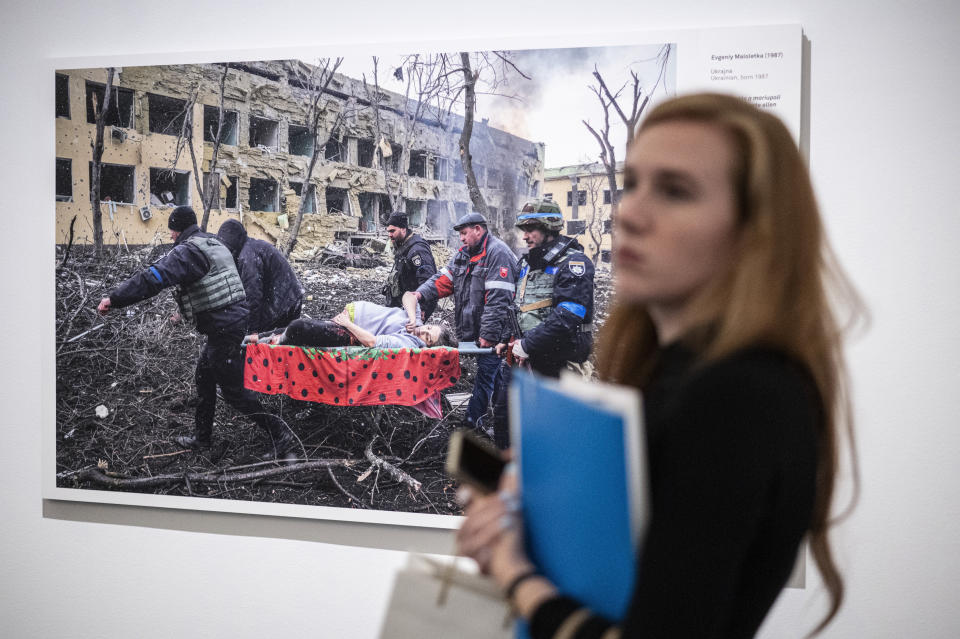 Associated Press photographer Evgeniy Maloletka's image entitled "Mariupol Maternity Hospital Airstrike", which was awarded the World Press Photo of the Year by the jury, on display at the opening of the World Press Photo 2023 exhibition at the Hungarian National Museum, in Budapest, Hungary, Thursday, Sept. 21, 2023. Minors under 18 have been barred from visiting this year’s World Press Photo exhibition in Hungary after the government determined that some of its photos violate a contentious law restricting LGBTQ+ content. (Szigetvary Zsolt/MTI via AP)
