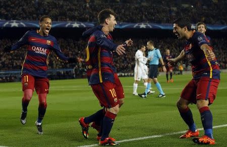 Football Soccer- Barcelona v AS Roma - UEFA Champions League Group Stage - Group E - Camp Nou, Barcelona, Spain - 24/11/15 Lionel Messi celebrates scoring the second goal for Barcelona with Neymar and Luis Suarez. REUTERS/Albert Gea