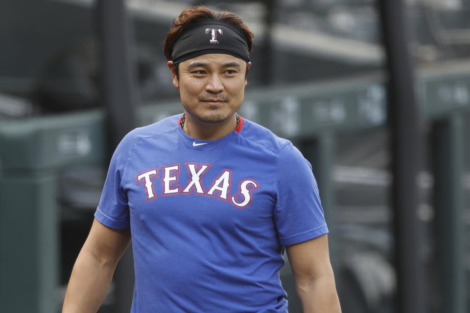 FILE - In this Aug. 14, 2020, file photo, Texas Rangers outfielder Shin-Soo Choo warms up before a baseball game against the Colorado Rockies in Denver. Free agent Choo has agreed to a one-year contract to play for a baseball club in his native South Korea. Choo, who spent the last seven seasons with the Texas Rangers, signed a 2.7 billion won ($2.4 million) deal with a Korean Baseball Organization team owned by an affiliate with the Shinsegae business group, the company said in a statement Thursday, Feb. 25, 2021. (AP Photo/David Zalubowski, File)