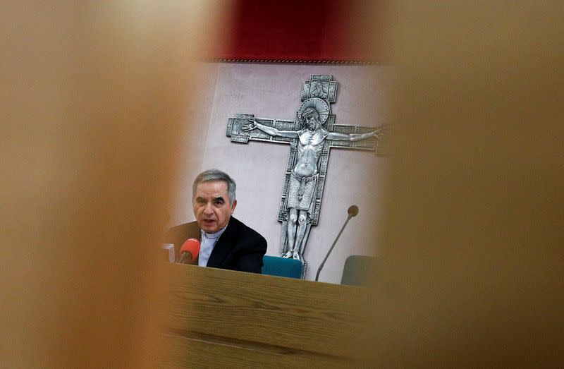 Cardinal Giovanni Angelo Becciu speaks to the media in Rome