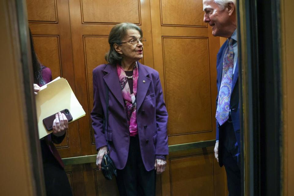 U.S. Sen. Dianne Feinstein, D-Calif., (C) talks to Sen. John Cornyn, R-Texas, (R) as they board an elevator at the U.S. Capitol on February 16, 2023 in Washington, DC.